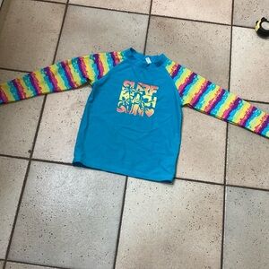 Swim top in great used condition. I can’t really find a size on the tag.